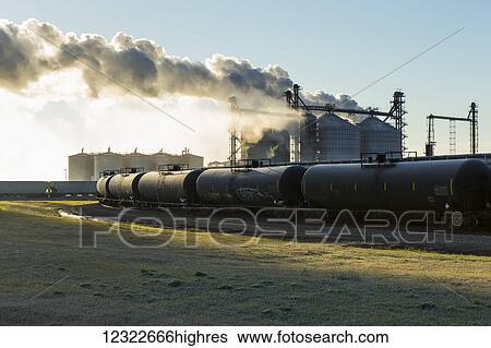 Railroad grain and tanker cars will transport corn and ethanol fuel to market from Glacial Lakes Energy ethanol plant near Mina; South Dakota, United States of America View Large Photo Image Stock Photograph - Railroad grain and tanker cars will transport corn and ethanol fuel to market from Glacial Lakes Energy ethanol plant near Mina; South Dakota, United States of America. Fotosearch