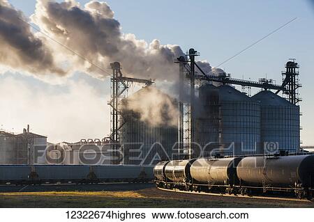 Stock Photograph - Railroad grain and tanker cars will transport corn and ethanol fuel to market from Glacial Lakes Energy ethanol plant near Mina; South Dakota, United States of America. Fotosearch