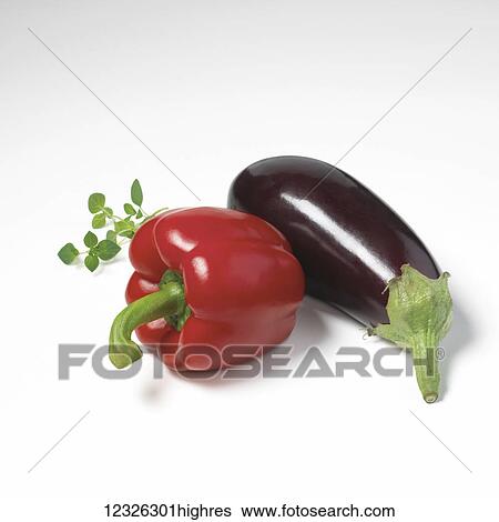 Stock Photograph - Red bell pepper and eggplant on a white background. Fotosearch