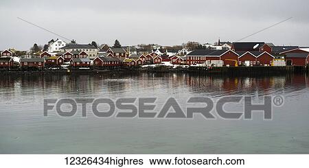 Red buildings along the water's edge under a cloudy sky; Lofoten Islands, Nordland, Norway View Large Photo Image Stock Photograph - Red buildings along the water's edge under a cloudy sky; Lofoten Islands, Nordland, Norway. Fotosearch
