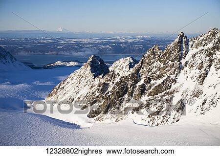 Stock Photograph - Redoubt Volcano, Lake Clark National Park And Preserve; Alaska, United States of America. Fotosearch