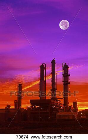 Picture - Refinery at sunset with moon. Fotosearch