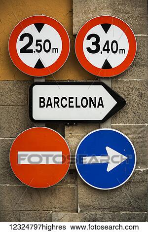 Road signs mounted on a wall; Barcelona, Catalonia, Spain View Large Photo Image Stock Photograph - Road signs mounted on a wall; Barcelona, Catalonia, Spain. Fotosearch
