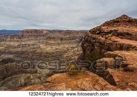 Rugged landscape with rock showing layers of sediment and erosion; Arizona, United States of America View Large Photo Image Stock Photograph - Rugged landscape with rock showing layers of sediment and erosion; Arizona, United States of America. Fotosearch