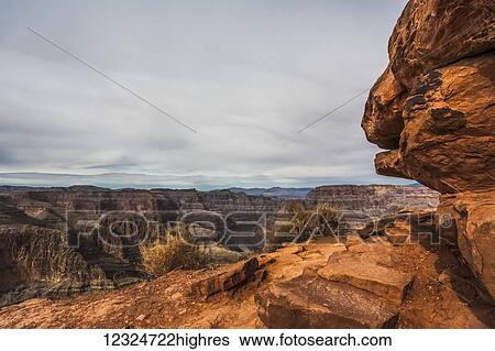Stock Photograph - Rugged landscape with rock showing layers of sediment and erosion; Arizona, United States of America. Fotosearch