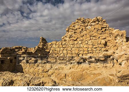Stock Photograph - Ruins of a stone wall, Masada, Judaean desert; South District, Israel. Fotosearch