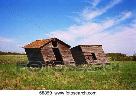 Stock Photo - Run down shacks in farmer's field. Fotosearch