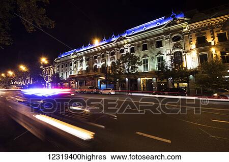 Stock Photograph - Rustaveli Theatre on Rustaveli Avenue at night; Tbilisi, Georgia. Fotosearch