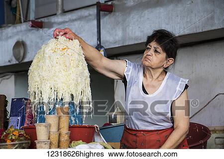 Stock Photograph - Sauerkraut vendor at the Shuka 0. 2 Food Market; Yerevan, Armenia. Fotosearch