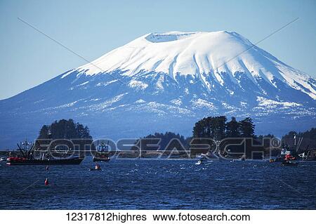 Stock Photograph - Scenic view of Sitka Sound and Mt. Edgecumbe during the Sac Roe Herring Fishery, Southeast Alaska, USA. Fotosearch