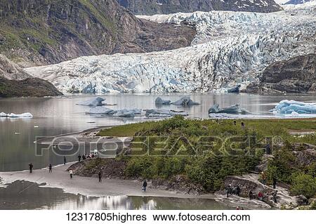 Scenic view of tourists visiting Mendenhall Glacier National Recreation Area, Juneau, Southeast Alaska, USA View Large Photo Image Stock Photograph - Scenic view of tourists visiting Mendenhall Glacier National Recreation Area, Juneau, Southeast Alaska, USA. Fotosearch