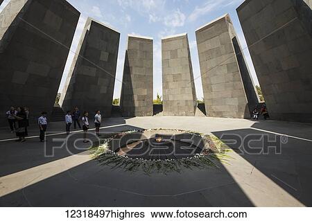 Stock Photograph - School children standing by the eternal flame dedicated to the 1. 5 million people killed during the Armenian Ge0cide in the Armenian Ge0cide memorial complex on Tsitsernakaberd hill; Yerevan, Armenia. Fotosearch