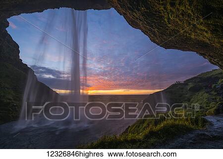 Seljandafoss, a beautiful waterfall that you can walk behind, at sunset on the South coast of Iceland; Iceland View Large Photo Image Stock Photograph - Seljandafoss, a beautiful waterfall that you can walk behind, at sunset on the South coast of Iceland; Iceland. Fotosearch
