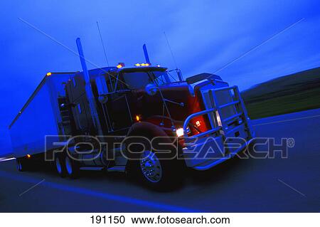 Semi truck driving on highway View Large Photo Image Stock Image - Semi truck driving on highway. Fotosearch