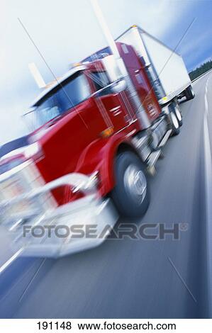 Semi truck driving on highway View Large Photo Image Stock Photo - Semi truck driving on highway. Fotosearch