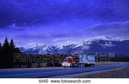 Semi truck on small mountain highway View Large Photo Image Stock Image - Semi truck on small mountain highway. Fotosearch