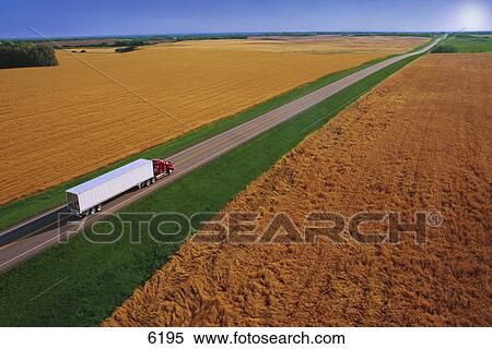 Stock Photography - Semi truck on small two lane highway. Fotosearch