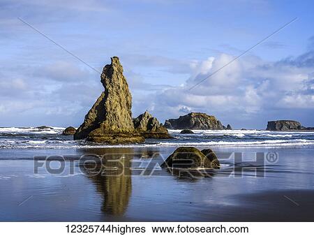 Stock Photograph - Several of the rocks at Bandon have fanciful names such as Howling Dog; Bandon, Oregon, United States of America. Fotosearch