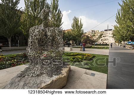 Stock Photograph - Shadows I, metal sculpture by Jaume Plensa, on display at the Cafesjian Museum of Art in the Yerevan Cascade; Yerevan, Armenia. Fotosearch