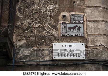 Stock Photograph - Sign for Boqueria Street on a decorative, carved stone wall; Barcelona, Catalonia, Spain. Fotosearch