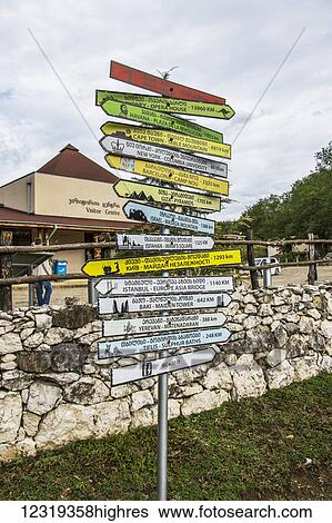 Stock Photograph - Sign post by Prometheus Cave; Imereti, Georgia. Fotosearch