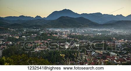 Silhouette of mountains and the view from Mount Phousi; Luang Prabang, Luang Prabang Province, Laos View Large Photo Image Stock Photograph - Silhouette of mountains and the view from Mount Phousi; Luang Prabang, Luang Prabang Province, Laos. Fotosearch