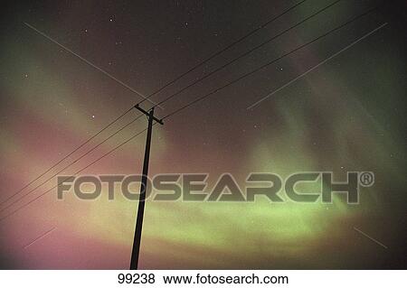 Silhouette of power lines with Northern lights Alberta Canada View Large Photo Image Stock Photo - Silhouette of power lines with Northern lights Alberta Canada. Fotosearch