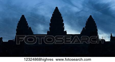 Stock Photograph - Silhouette of the buddhist structures in the temple complex of Angkor Wat; Krong Siem Reap, Siem Reap Province, Cambodia. Fotosearch