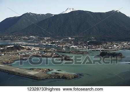 Stock Photograph - Sitka Sound, with cloudy water from herring milt; Alaska, United States of America. Fotosearch