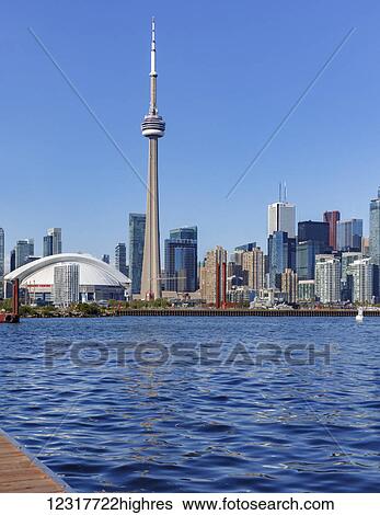Stock Photograph - Skyline of Toronto viewed from Lake Ontario; Toronto, Ontario, Canada. Fotosearch