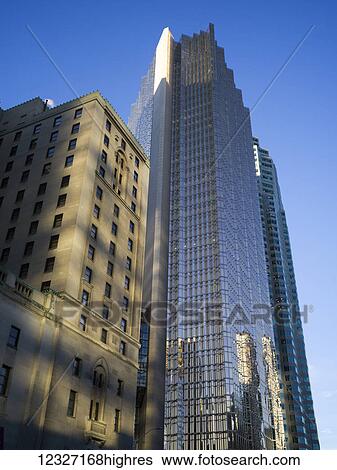 Stock Photograph - Skyscrapers with different facades against a blue sky; Toronto, Ontario, Canada. Fotosearch