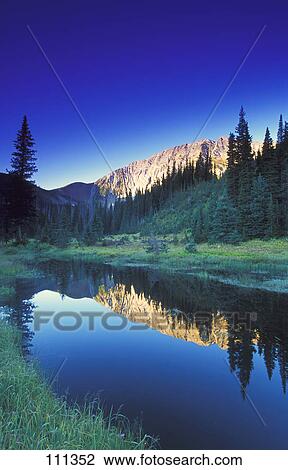 Stock Image - Small calm mountain creek. Fotosearch