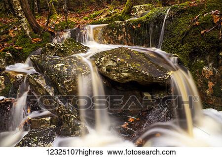 Stock Photograph - Small waterfall in the woods in autumn; Bedford, Nova Scotia, Canada. Fotosearch