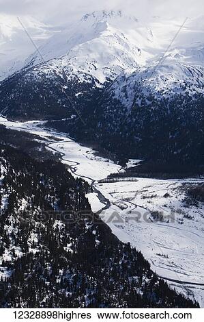 Stock Photograph - Snow covered Kenai Mountains, Kachemak Bay State Park; Alaska, United States of America. Fotosearch