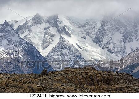 Stock Photograph - Snow covered mountains in Torre del Paine National Park in Chilean Patagonia; Torres del Paine, Magallanes, Chile. Fotosearch