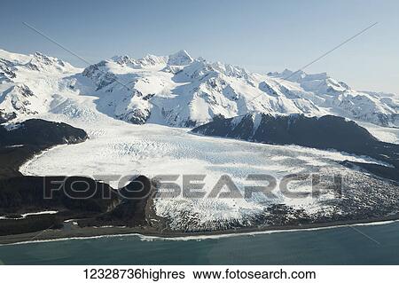 Stock Photograph - Snow covered mountains of the Fairweather Range, Glacier Bay National Park, Gulf of Alaska; Alaska, United States of America. Fotosearch
