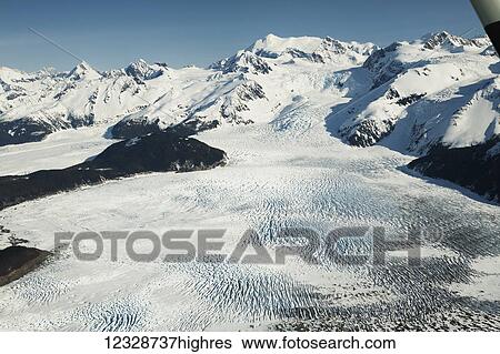 Stock Photograph - Snow covered mountains of the Fairweather Range, Glacier Bay National Park, Gulf of Alaska; Alaska, United States of America. Fotosearch