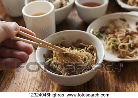 Stock Photograph - Spicy noodles, a famous traditional dish in the city; Chongqing, China. Fotosearch