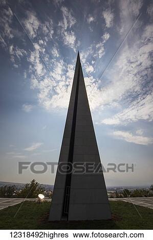 Stock Photograph - Stele symbolizing the national rebirth of Armenians at Armenian Ge0cide memorial complex on Tsitsernakaberd hill; Yerevan, Armenia. Fotosearch