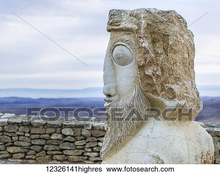 Stock Photograph - Stone statue of head, Ramon Nature Reserve; Mitspe Ramon, Israel. Fotosearch
