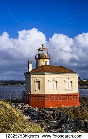 Stock Photograph - Sunlight bathes the Coquille River Lighthouse on the Oregon Coast; Bandon, Oregon, United States of America. Fotosearch