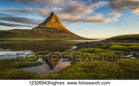 Stock Photograph - Sunrise over Kirkjufell, Snaefellsness Peninsula; Iceland. Fotosearch