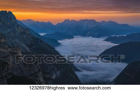 Stock Photograph - Sunrise over Natural Park Tre Cime in the Italian Dolomites; Italy. Fotosearch