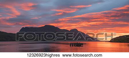 Stock Photograph - Sunrise over the waters near Djupavik, Strandir Coast; West Fjords, Iceland. Fotosearch
