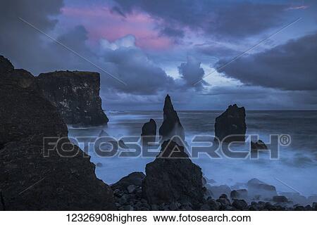 Sunset colours the skies over the pounding surf at the tip of the Reykenanes peninsula; Iceland View Large Photo Image Stock Photograph - Sunset colours the skies over the pounding surf at the tip of the Reykenanes peninsula; Iceland. Fotosearch