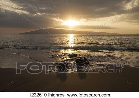 Stock Photograph - Sunset over Lanai Isle; Lahaina, Maui, Hawaii, United States of America. Fotosearch