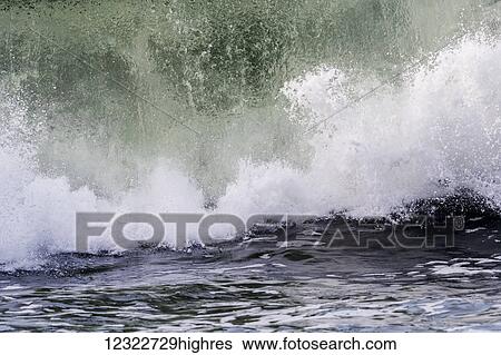 Stock Photograph - Surf breaks near the shore; Seaside, Oregon, United States of America. Fotosearch