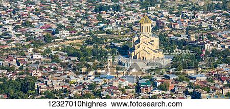 Stock Photograph - Tbilisi, the capital and the largest city of Georgia, with Sameba (Holy Trinity Cathedral of Tbilisi); Tbilisi, Georgia. Fotosearch