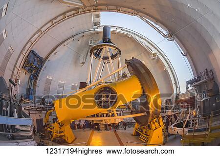 Stock Photograph - Telescope inside CFHT (Canada France Hawaii Telescope) Observatory atop Mauna Kea in Hawaii; Island of Hawaii, Hawaii, United States of America. Fotosearch