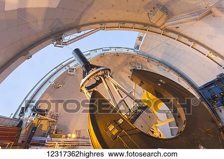 Stock Photograph - Telescope inside CFHT (Canada France Hawaii Telescope) Observatory atop Mauna Kea, 4200 meter mountain in Hawaii; Island of Hawaii, Hawaii, United States of America. Fotosearch